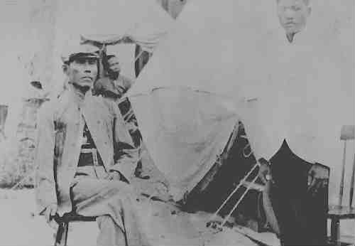 Apolinario Mabini sits outside his tent in Guam 1902