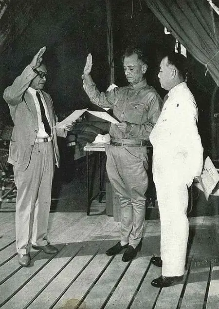 President Manuel L. Quezon swearing in Dr. Jose P. Laurel as Secretary of Justice of the War Cabinet