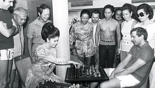 First Lady Imelda playing chess with Bobby Fischer