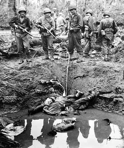 Four Japanese snipers shot and killed in the muddy water of a bomb crater