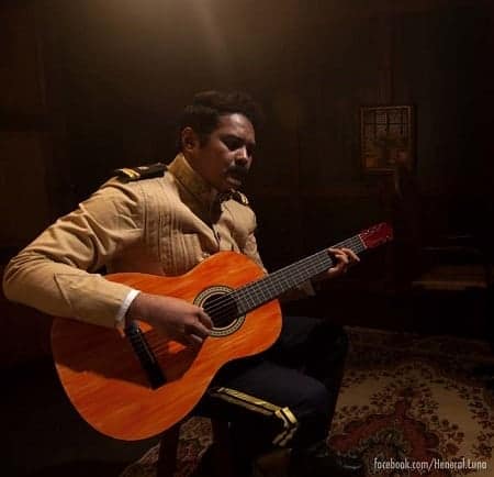 Heneral Luna playing a guitar