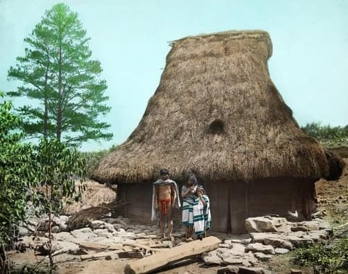 Lepanto Igorot family stand outside their house in northern Luzon