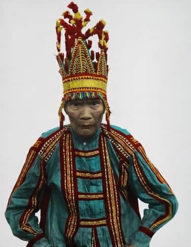 A Bukidnon chief wears a head ornament indicating he has killed men.
