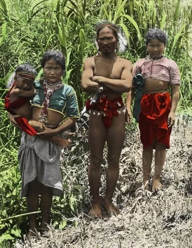 An Ilongot family in traditional clothing poses for a portrait