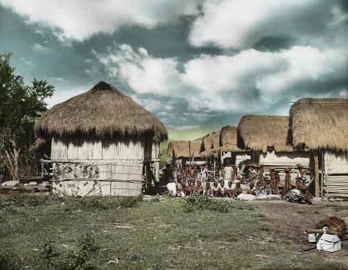 Villagers group together in a small Tinggian Igorot village